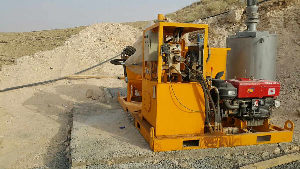 grout injection station for underground foundation